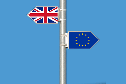 EU flag and Union Jack on a flag pole