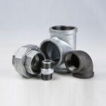 An assortment of threaded pipe fittings