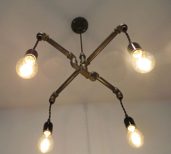 A light fixture made of malleable iron pipe fittings