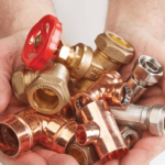 An assortment of copper and brass fittings for plumbing and heating.